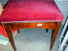 A red covered piano stool. Collect Only.