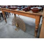 A large pine scrub top kitchen table with turned legs