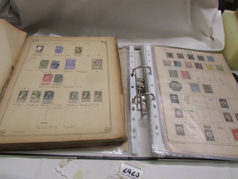 Two albums of early world stamps.