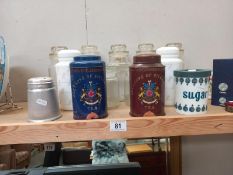 A selection of glass, plastic and metal storage jars and a flour sifter