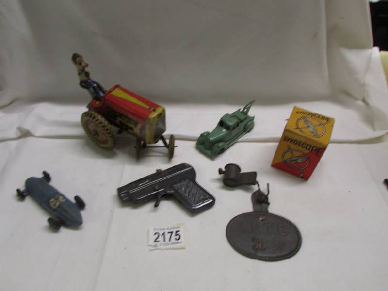 A tin plate Mettoy tractor, a Dinky Talbot Lago, a boxed Gyroscope etc.,