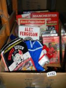 A selection of football memorabilia including books & videos etc.