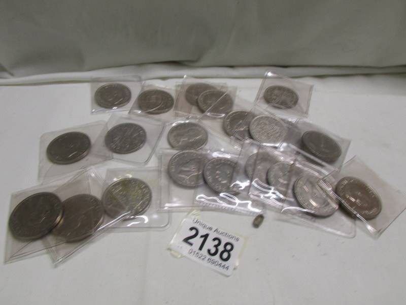 21 uncirculated half crowns, various dates 1947-1965.