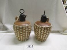 A pair of Victorian basket weave stoneware whisky and brandy flasks.