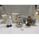 A mixed lot including Doulton figure 'Bedtime', a Poole vase, a Doulton silver jubilee mug etc.,