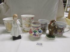 A mixed lot including Doulton figure 'Bedtime', a Poole vase, a Doulton silver jubilee mug etc.,