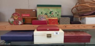A collection of decorative cardboard & wooden boxes, some modern oriental types