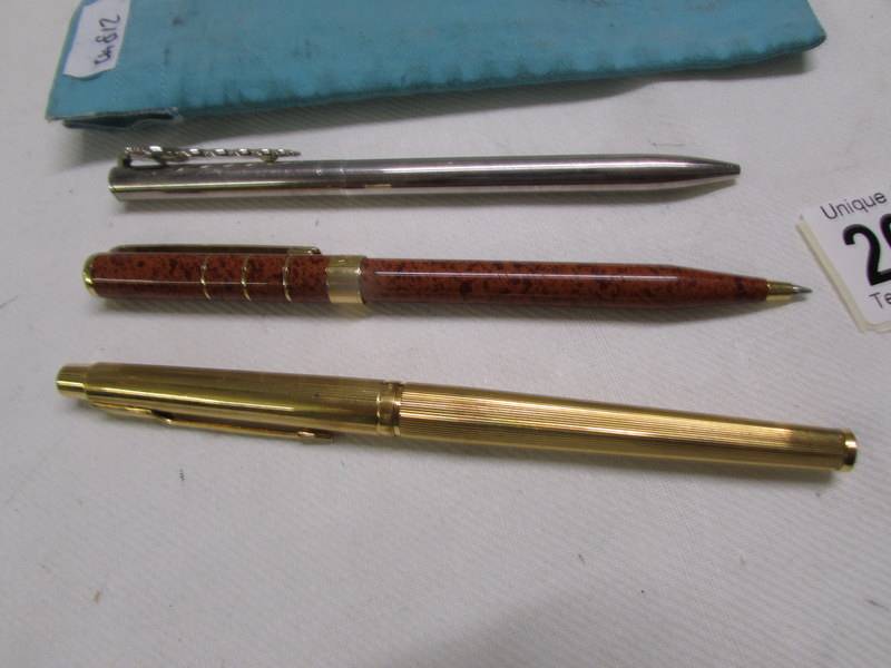 A silver Tiffany pen, a Parker pen and an Yves Saint Laurent pen. - Image 2 of 2