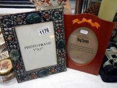 2 unusual picture frames, 1 possibly silver embellished with hard stones others inlaid