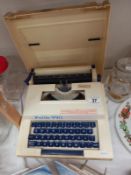 A Petite 990 vintage cased typewriter
