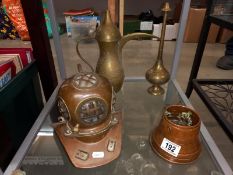 A number of brass and copper ornaments, mini divers helmet, Arabic style jug etc