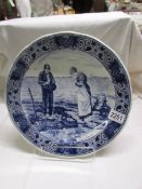 A Delft blue and white charger, 33 cm diameter.