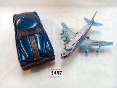 A tinplate friction American style car and Japanese tinplate friction Lufthansa Boeing 747 aeroplane