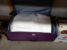 A large suitcase of linen & lace