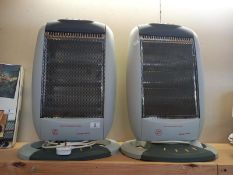 A pair of oscillating halogen heaters. COLLECT ONLY