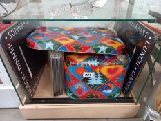 A selection of placemats and large storage tins