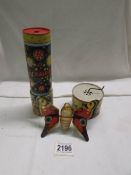 A vintage clockwork tin plate butterfly, Kaleidescope and musical box tin.