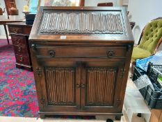 A bureau (1 drawer over doors) with linen fold carved panels COLLECT ONLY