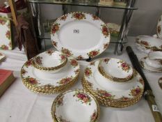 Twelve Royal Albert Old Country Roses dinner plates, an oval platter, four soup bowls and 8 dessert.