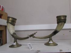 A pair of horn candle holders.