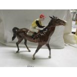 A Beswick horse with jockey, discontinued 1976. In good condition.