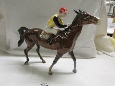 A Beswick horse with jockey, discontinued 1976. In good condition.