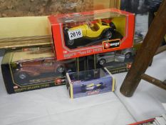 Three boxed Burago die cast models including Jaguar and Bugatti.