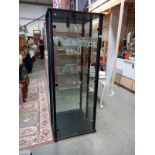 A mirror backed glass display case with wood frame and glass shelves (68cm x 36cm x 171cm height)