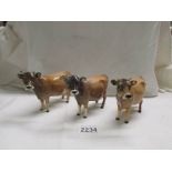 Three Beswick Jersey cows, all have damage to horns.