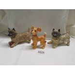 Two Beswick terriers (one with chip on ear) and another Beswick dog,