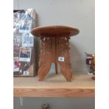 A small carved wood stand (31cm diameter x 31cm height ) COLLECT ONLY