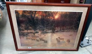 A framed and glazed print of a winter scene with sheep. COLLECT ONLY.