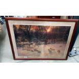 A framed and glazed print of a winter scene with sheep. COLLECT ONLY.