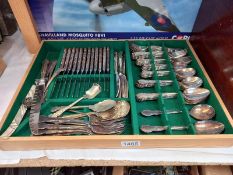 A quantity of cutlery in cutlery box