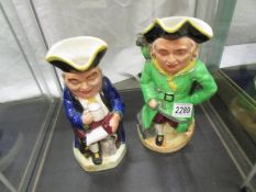 A musical Toby jug with Swiss movement and a Burlington ware Toby jug.