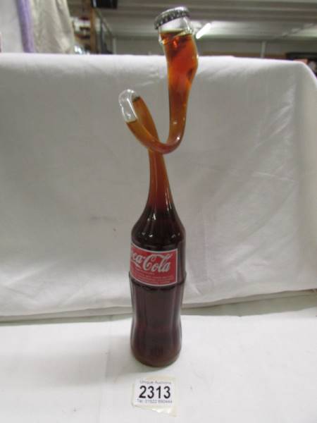 A novelty vintage mis-shapen coke bottle.