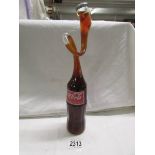 A novelty vintage mis-shapen coke bottle.