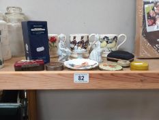 A mixed lot of items including figures and mugs etc.