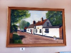 A painting on board of cottages signed EAB 1986