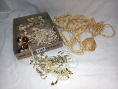 A tray of costume necklaces etc.