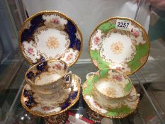 Two Coalport trio's and a Coalport cup and saucer.