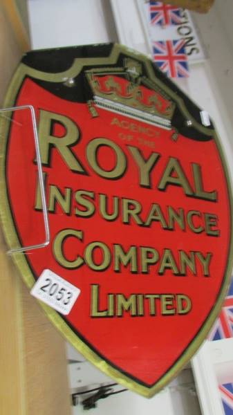 A vintage Royal Insurance Co., Ltd shield shaped glass sign.