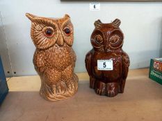 A pottery owl money box and an owl figure height 20.5cm and 22.5cm