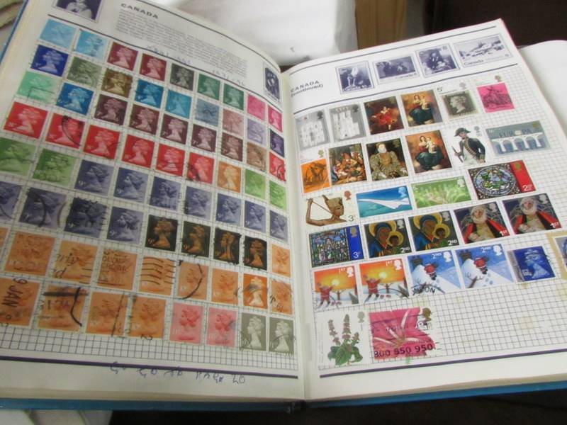 A collection of UK stamps in five albums/folders. - Image 3 of 14