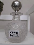 A fine crystal scent bottle with sterling silver top.