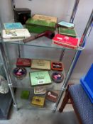 3 shelves of tobacco and cigarette tins