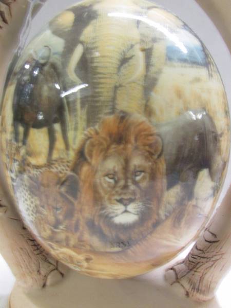 A decorated ostrich egg depicting elephants and other wild animals. - Image 2 of 6