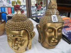 Two gilded resin Buddha heads.