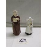 Two Royal Worcester candlesnuffers, a monk and a nun.