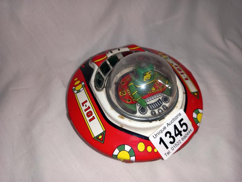 A tinplate wind up bump and go tin treasures, tin toy collectables UFO flying saucer. Diameter 13. - Image 2 of 3